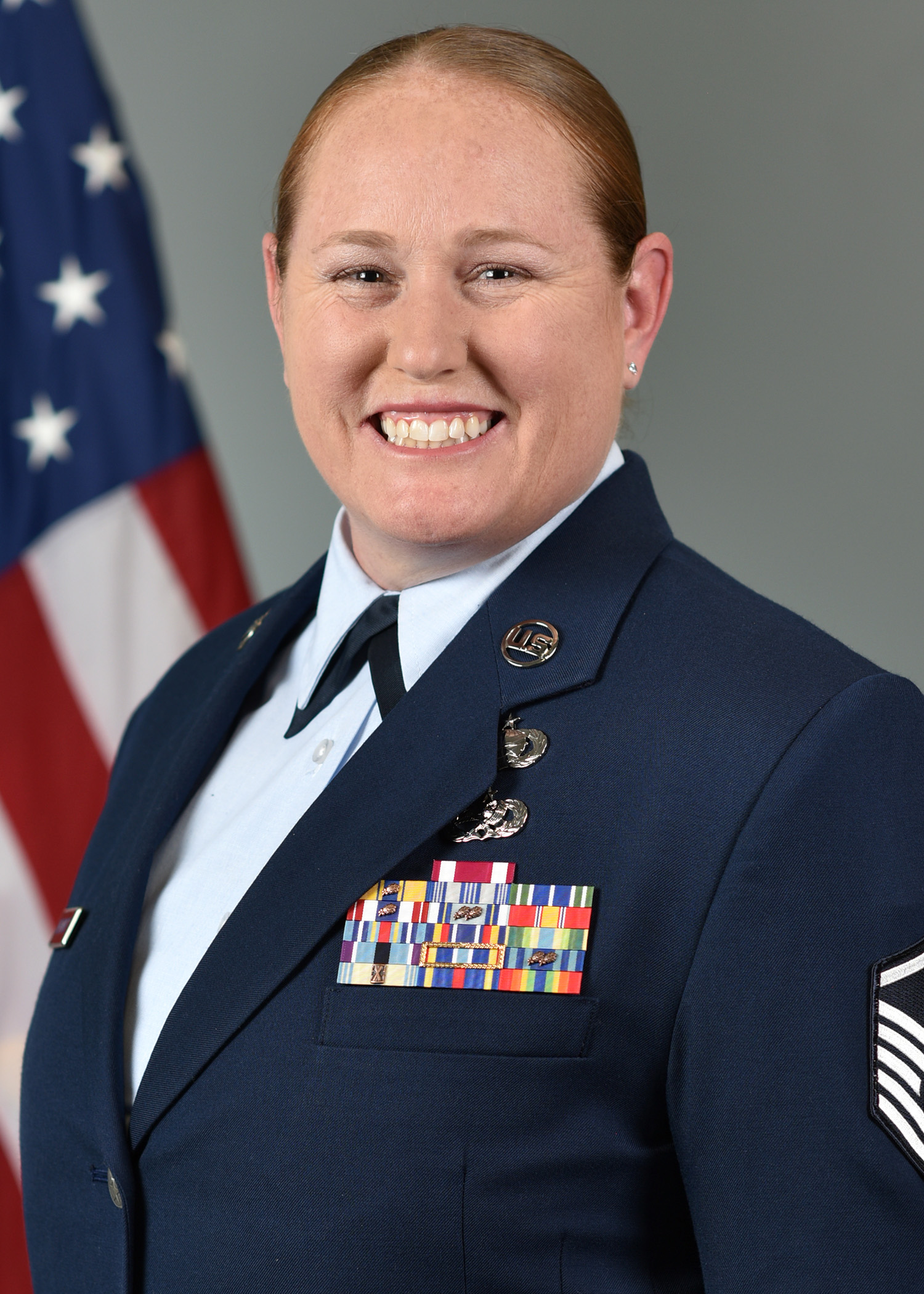 Krystal Smethurst Standing in front of an American Flag